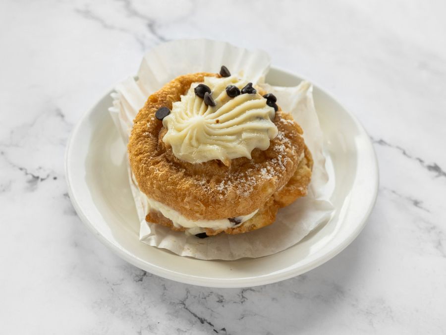 Cream puff filled with cannoli cream and chocolate chips