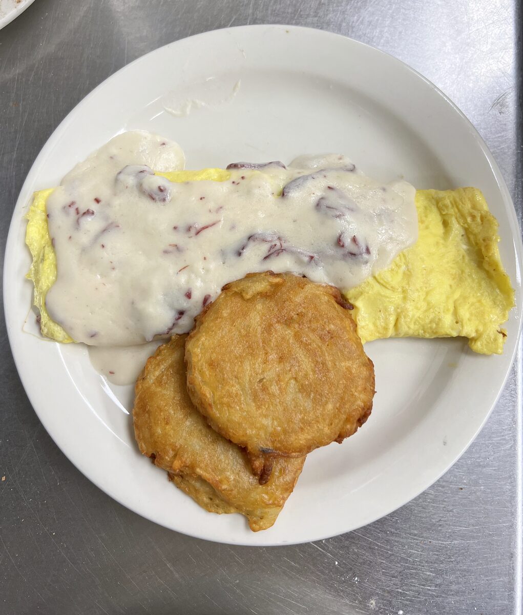 Chipped beef omelette with potato pancakes