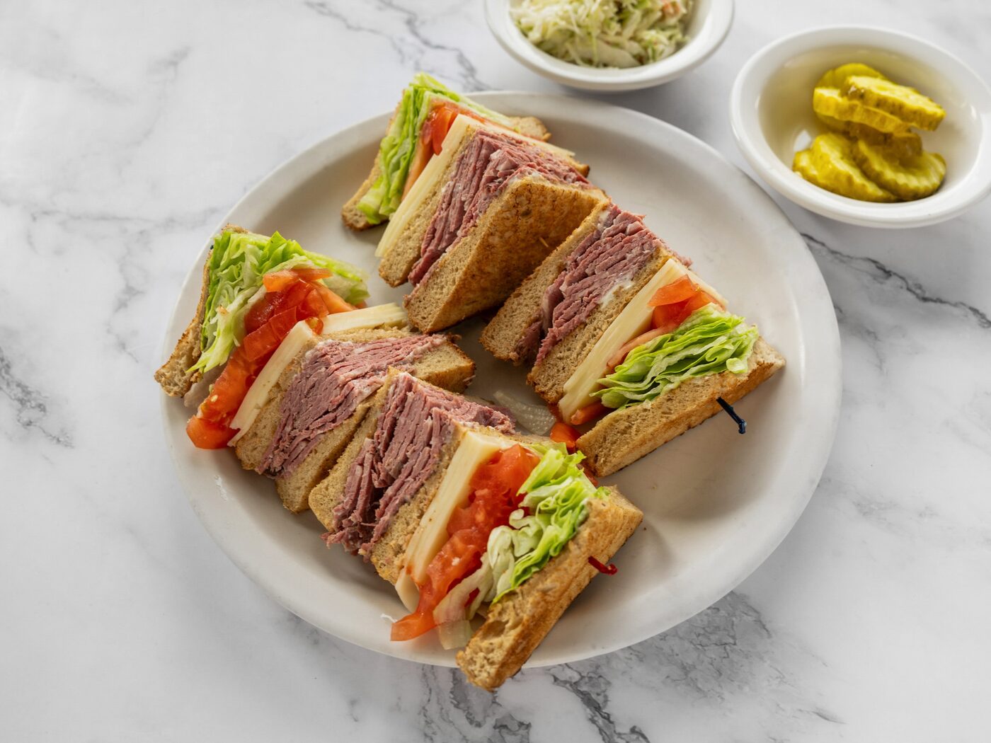 Corned beef and Swiss club sandwich