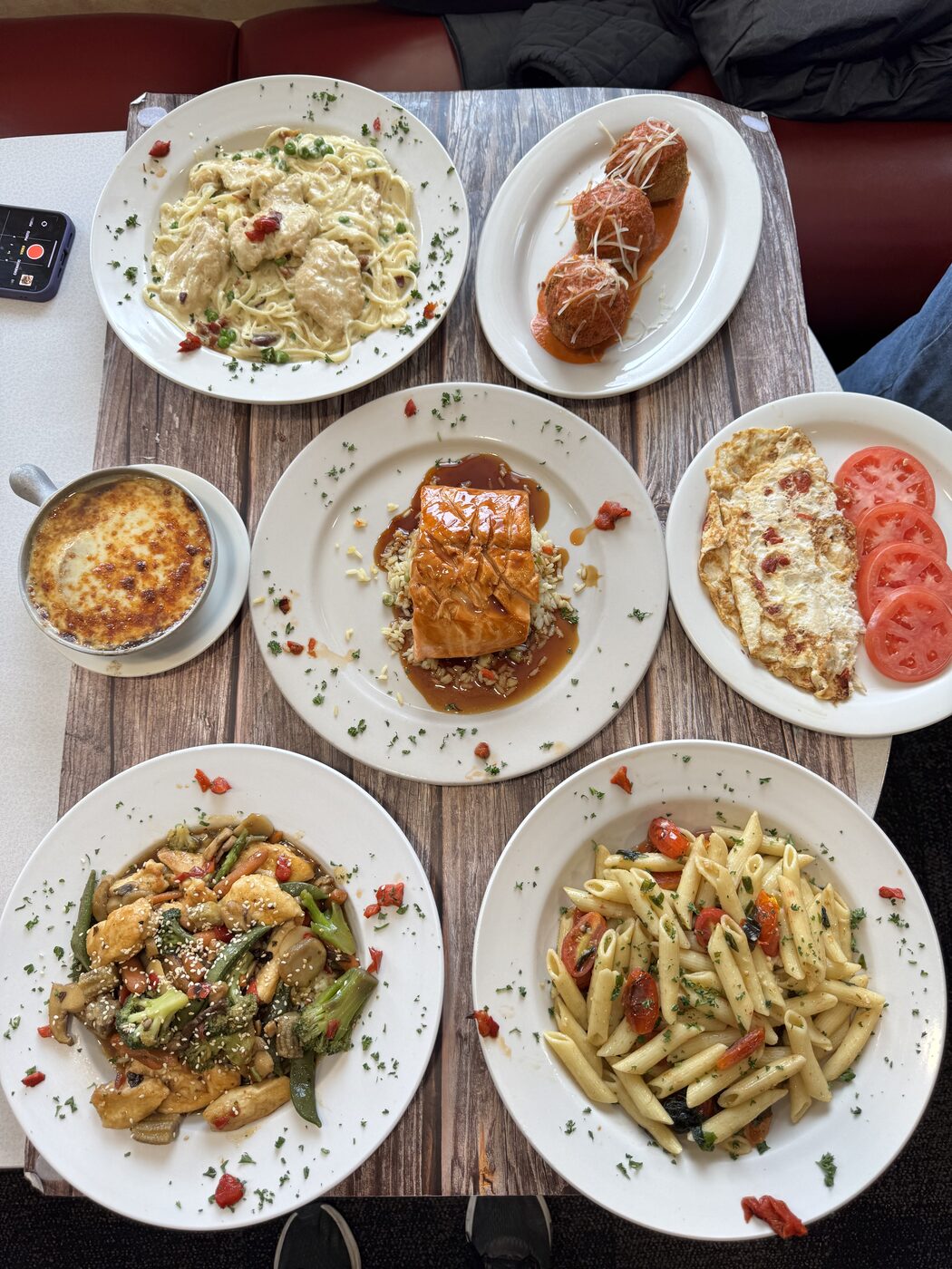 A table full of Dining Car pasta dishes and entrées
