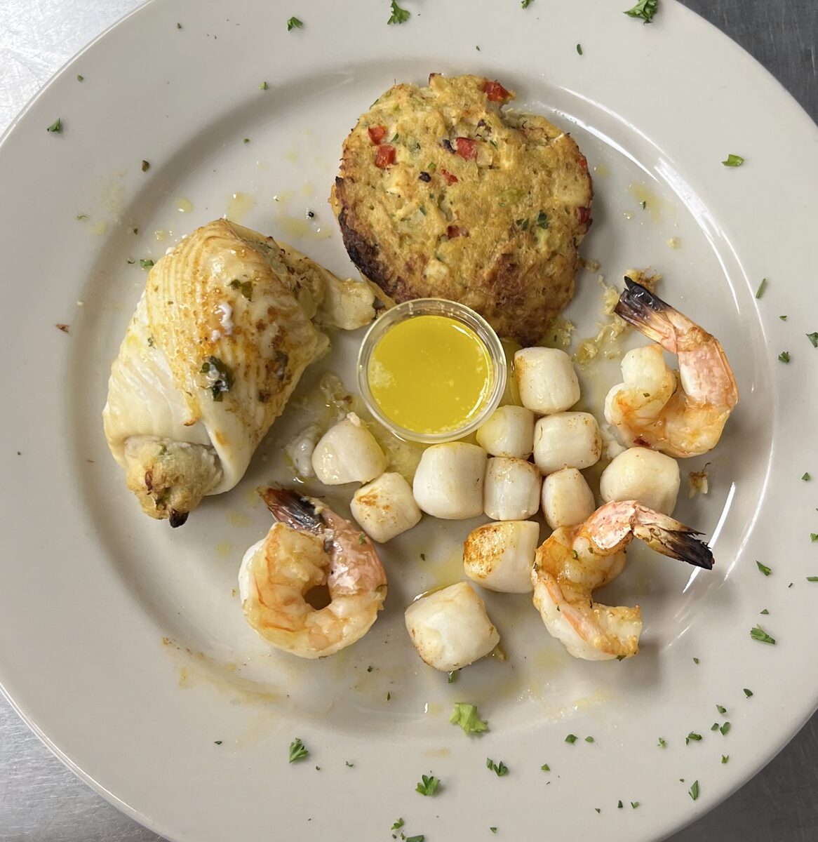 Broiled seafood combination — stuffed flounder, crab cake, shrimp and scallops